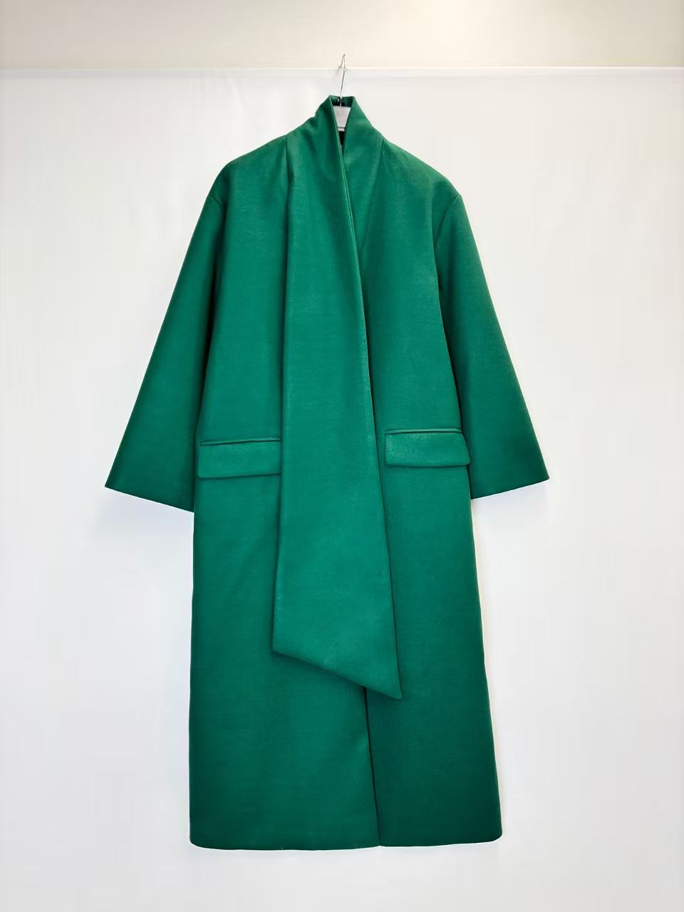 Coat with decorative scarf