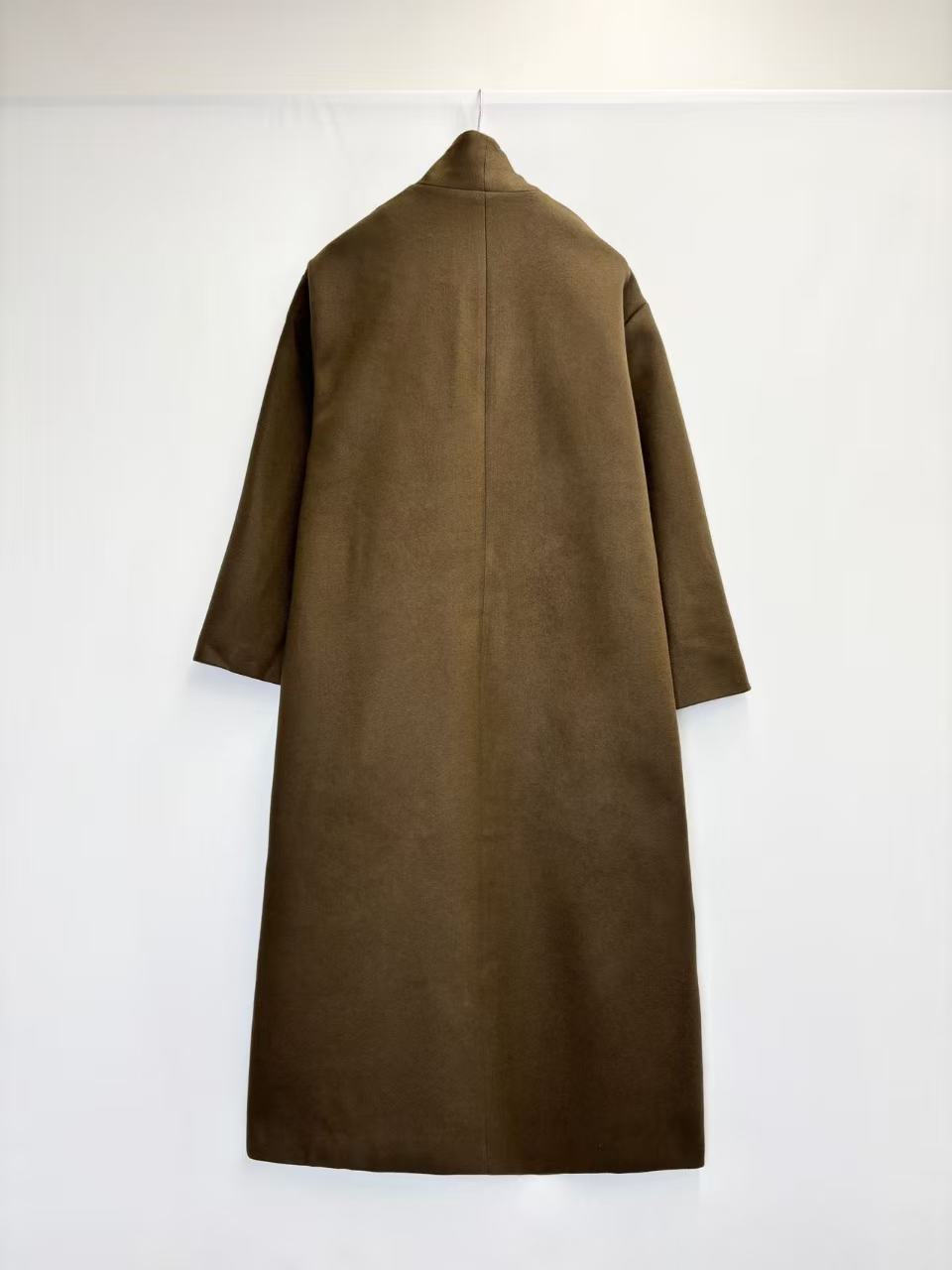 Coat with decorative scarf